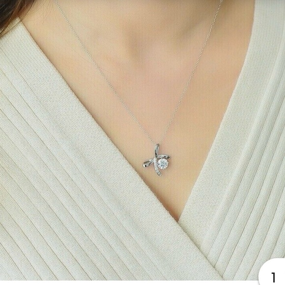 Moissanite bow pendant with silver necklace